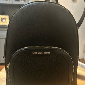 Michael Kors Black Leather Backpack with Gold Accents
